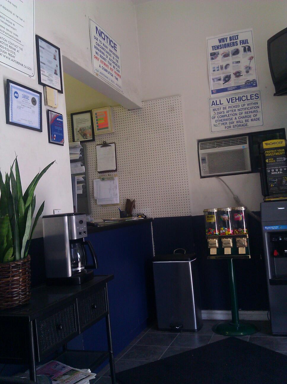 The waiting area at Galaxy Automotive with framed certificates on the wall